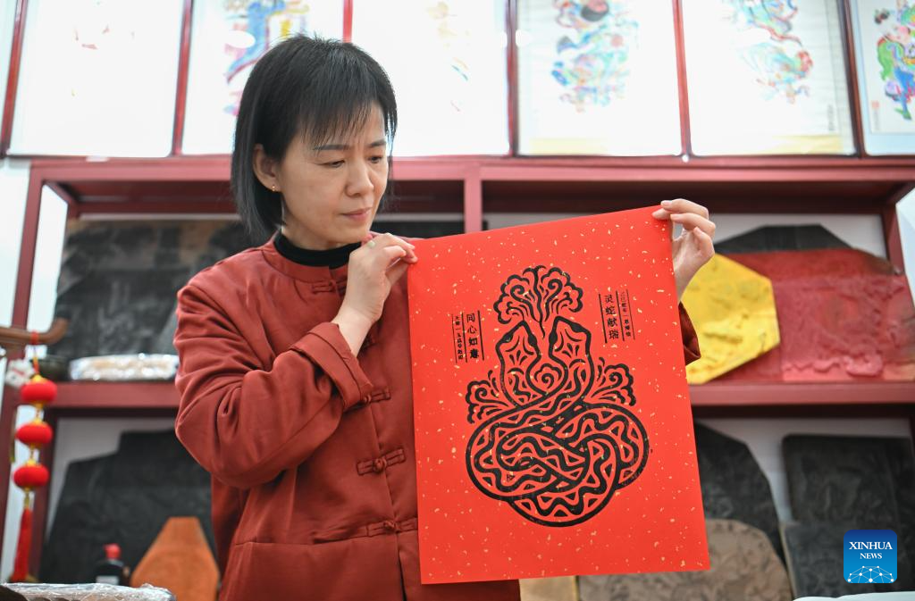 Products with Yangliuqing woodblock new year pictures created under inspiration of Year of Snake in Tianjin